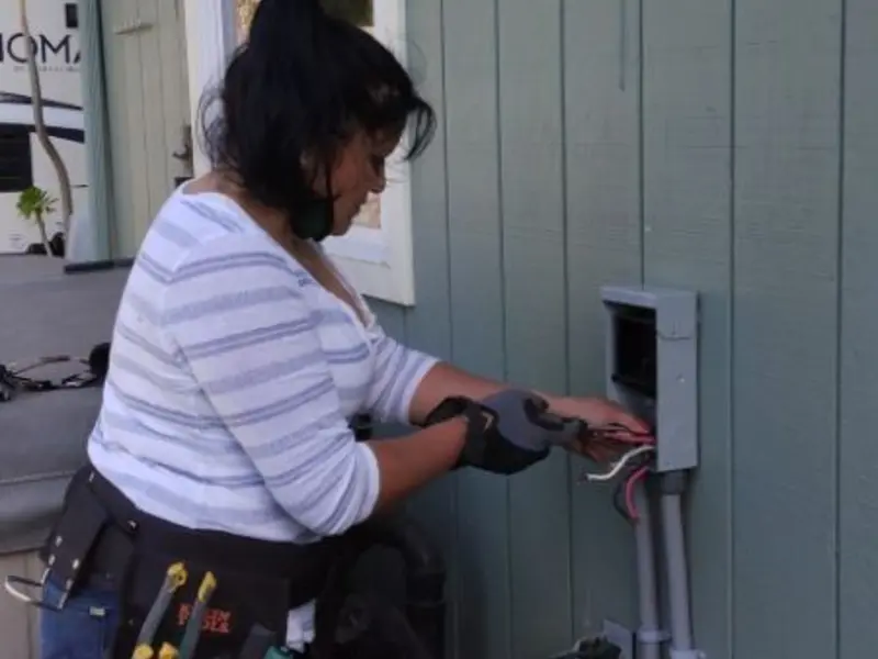 Licensed electrician wiring an exterior subpanel in Barbourville